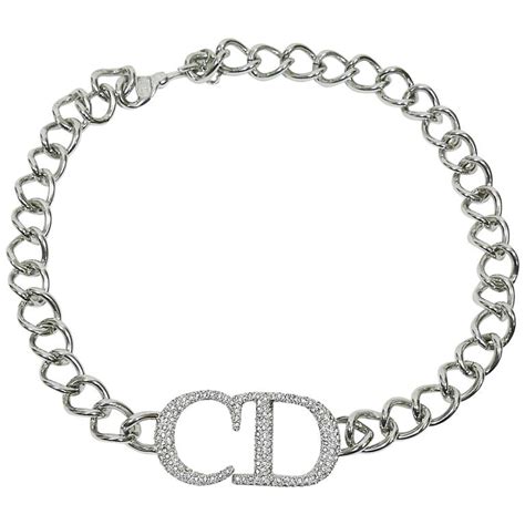 silver oval necklace that says dior|christian dior charm station necklace.